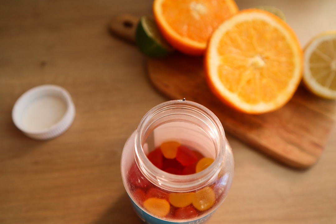 Vitamin D supplements and sunlight through a window, illustrating daily dose considerations for adults